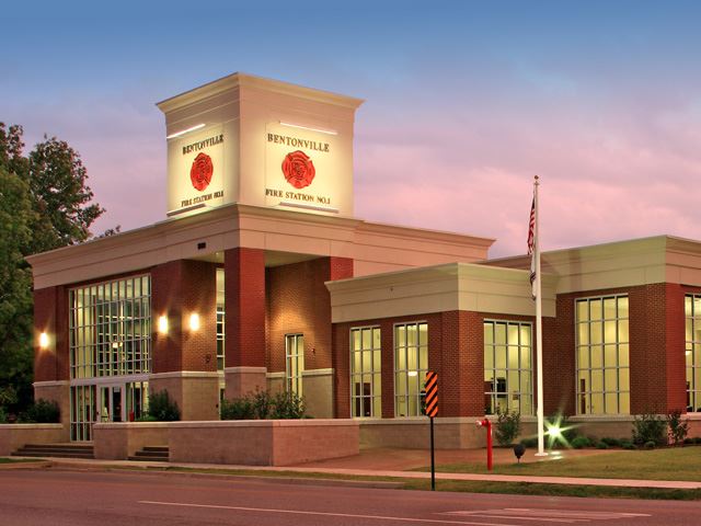 Station 1 at dusk with lawn and street